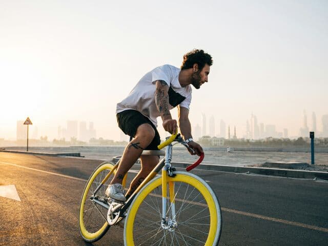 Cyclist riding at sunset