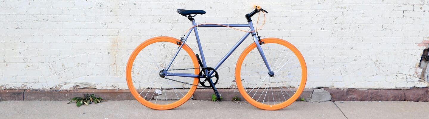 Road bike against a wooden wall